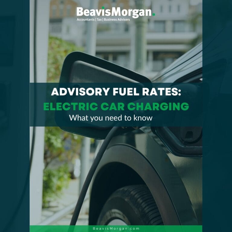 Article title with a faded image of an electric car being charged.